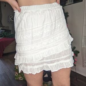 LoveShackFancy white lacy, tiered mini skirt